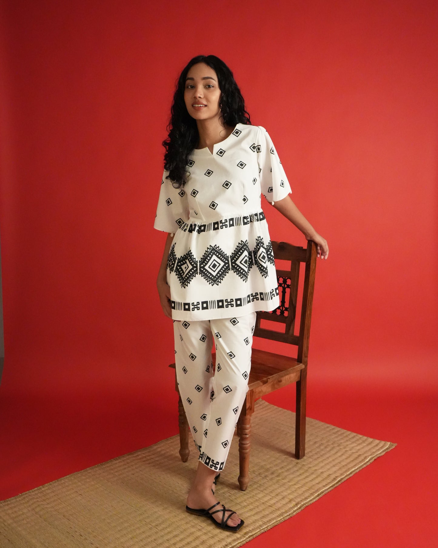 Front view of Shiro Cotton Co-ord Set in black and white with shell-detailed flared sleeves, tribal motifs, and slim pants