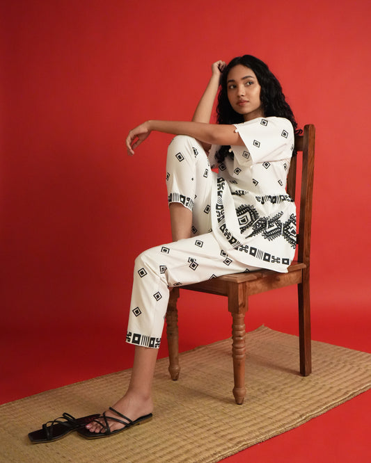 Model wearing Shiro Cotton Co-ord Set in black and white with flared sleeves, tribal motifs, and slim pants.