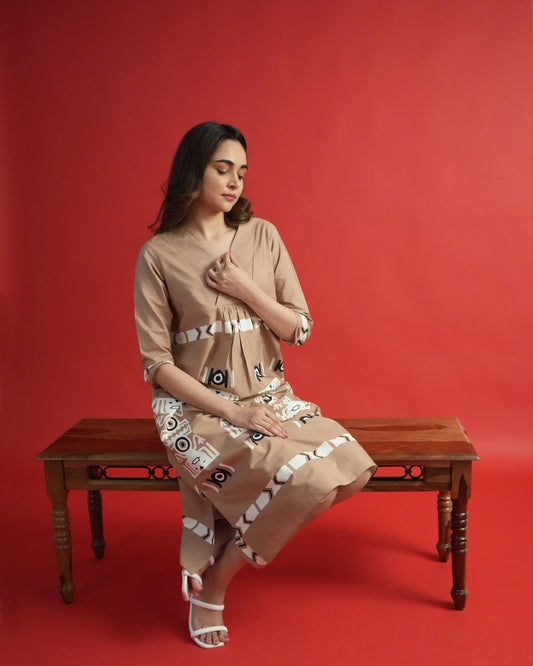 Side view of Chaki Cotton Co-ord Set in beige cotton with tribal-inspired prints and narrow pants