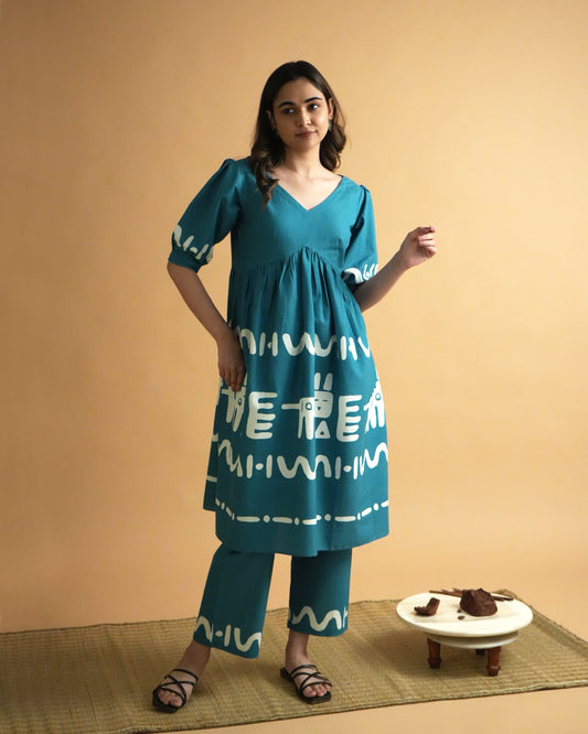 Front view of Polu Cotton Co-ord Set in teal blue with V-neck kurta, puff sleeves, tribal prints, and wide-leg pants
