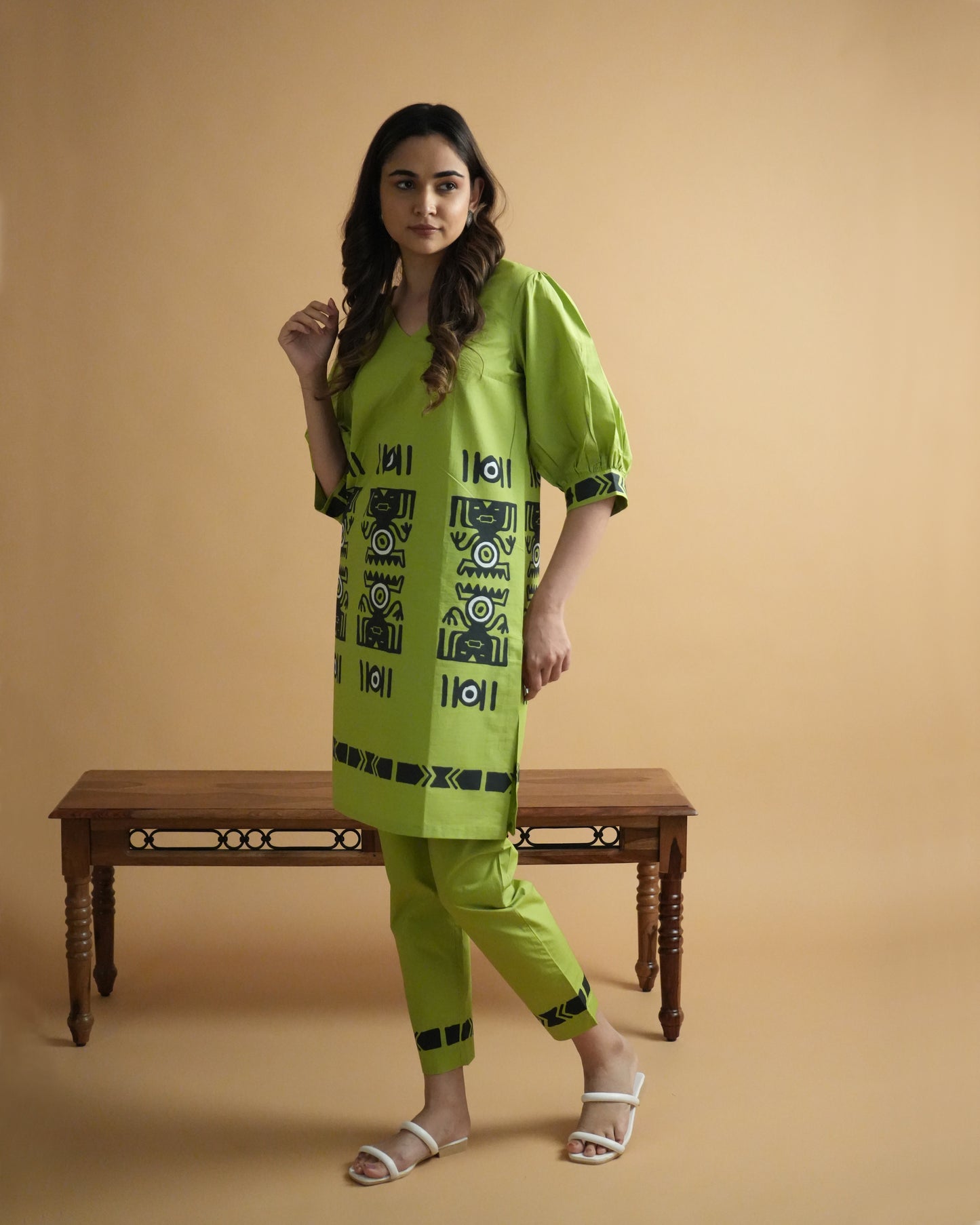 Front view of Amali Cotton Co-ord Set in leaf green with V-neck kurta, puff sleeves, tribal motifs, and straight-fit pants