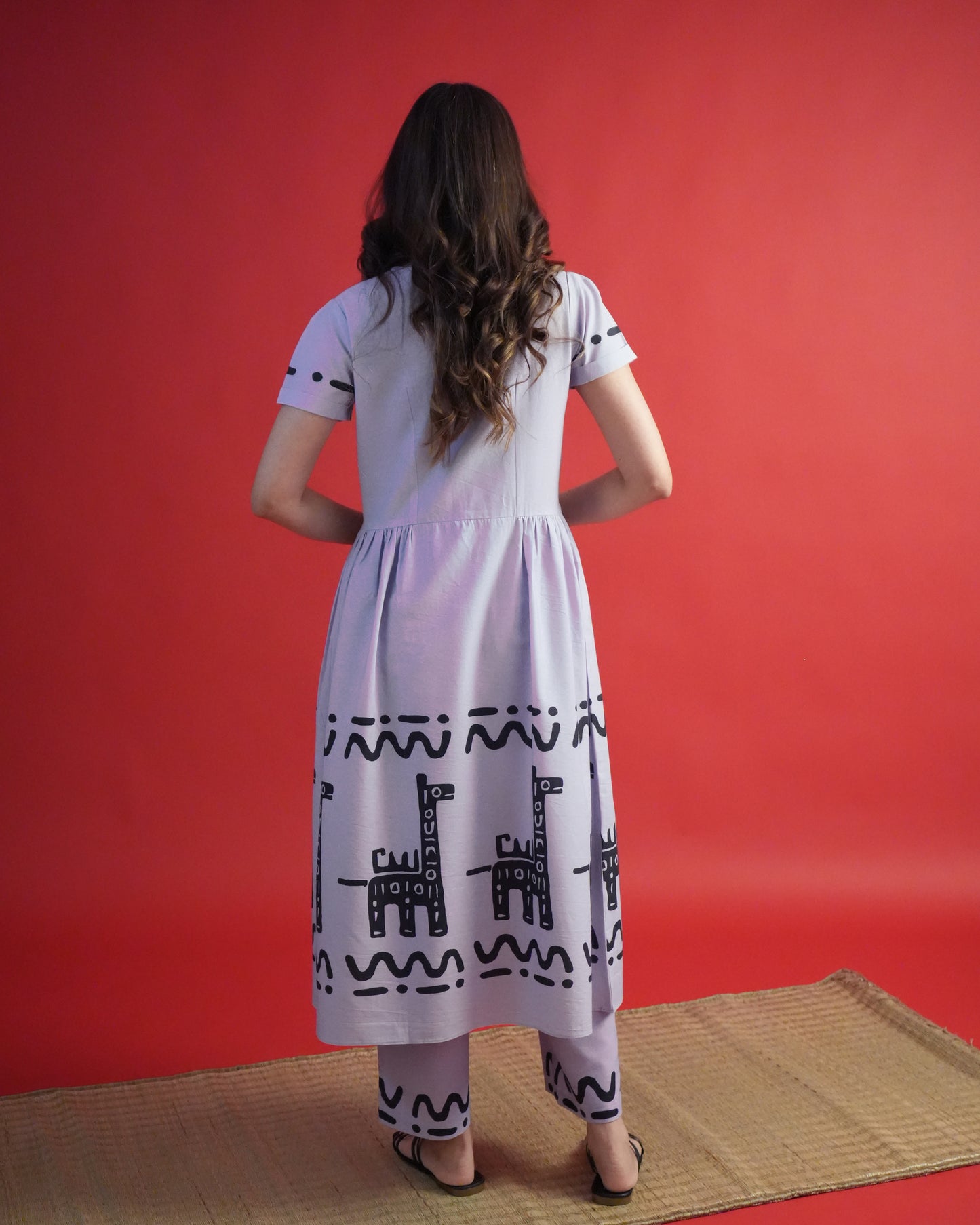 Back view of Usu Cotton Kurta Co-ord Set in lavender showing lapel-collar kurta, cuffed sleeves, and wide-leg pants