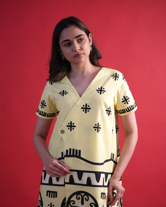 Detailed shot of the neckline and sleeve of the pastel yellow wrap kurta in the Kiiro Cotton Co-ord Set