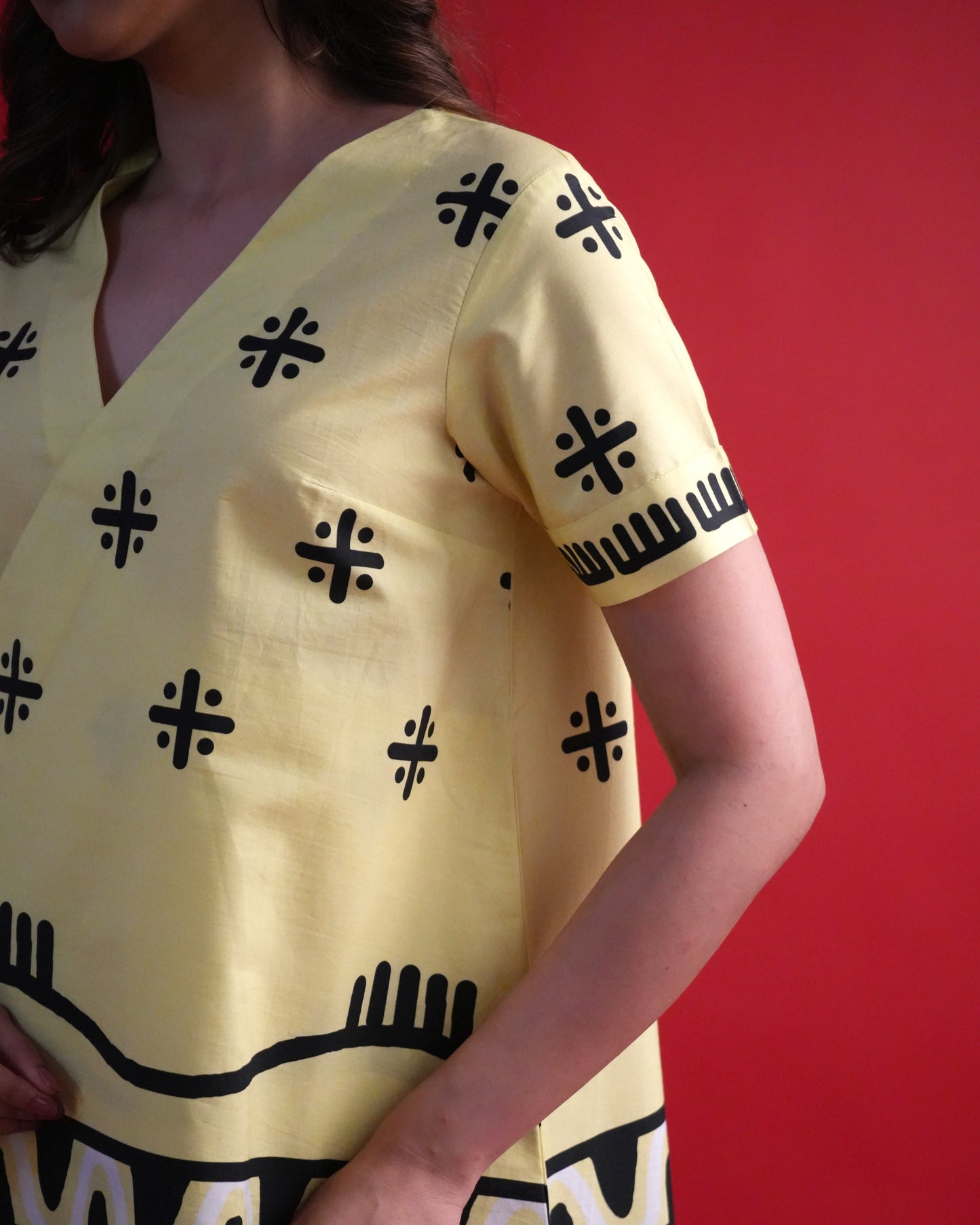 Fabric close-up showing cotton poplin texture and tribal motifs of the Kiiro Cotton Kurta Co-ord Set