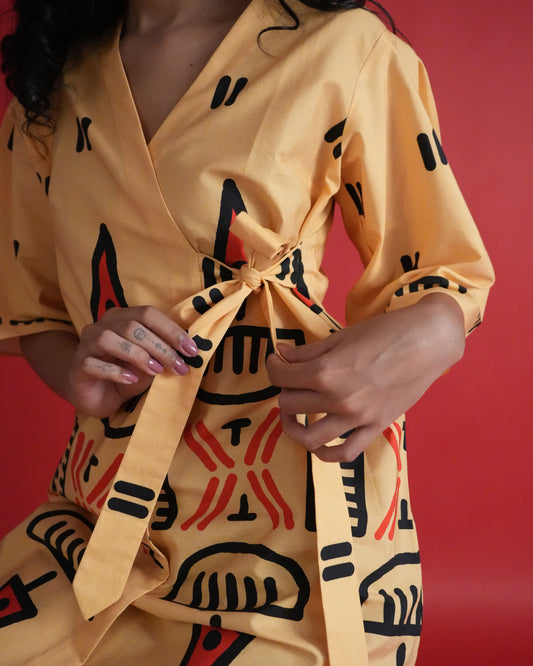 Close-up of tie detail on pastel orange kurta from the Owu Cotton Co-ord Set.