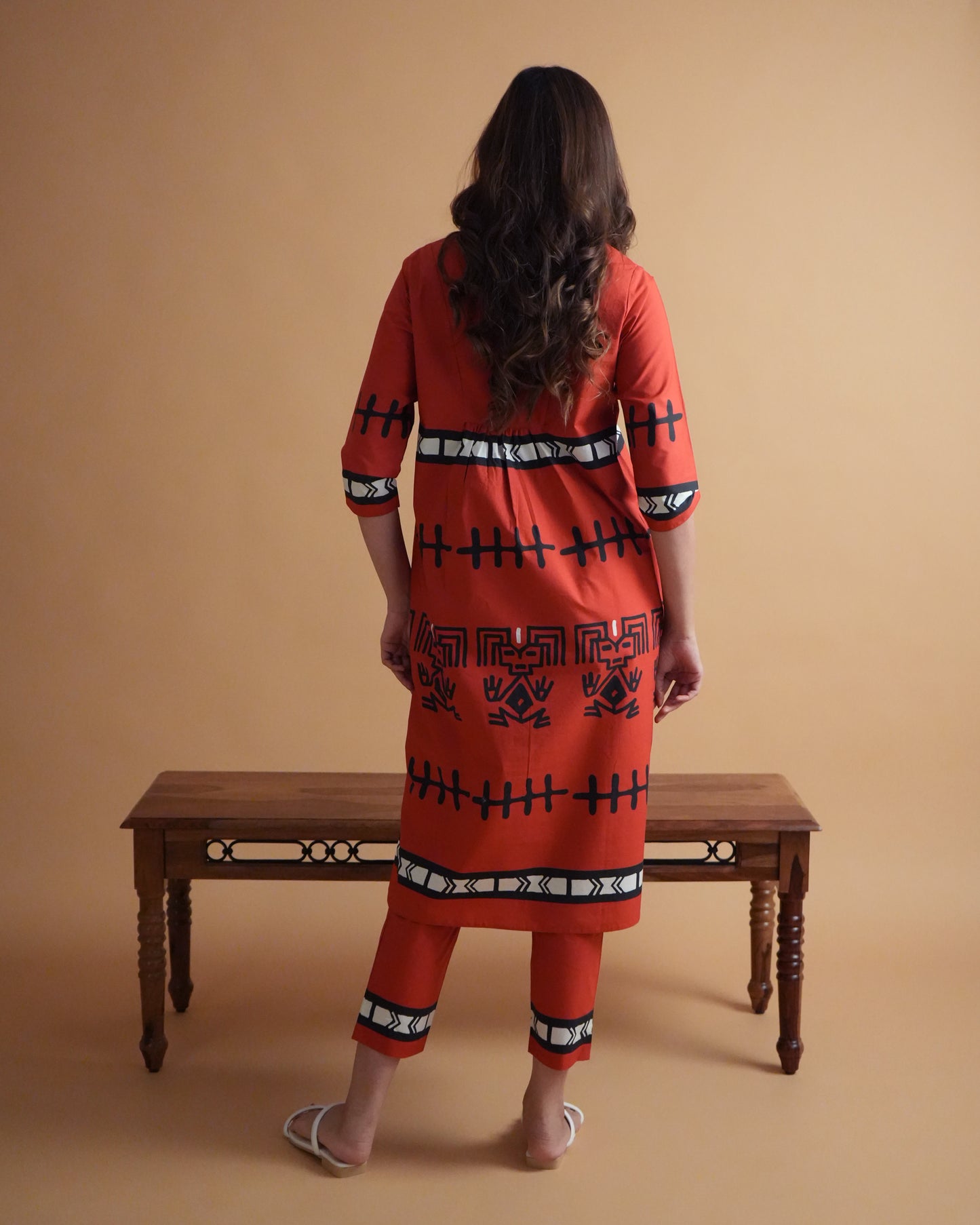 Back view of vibrant red Puka Cotton Kurta Co-ord Set showing side-slit kurta and slim trousers