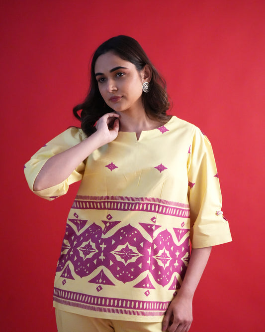 Detailed shot of tribal prints on lemon yellow cotton fabric from the Yona Cotton Co-ord Set