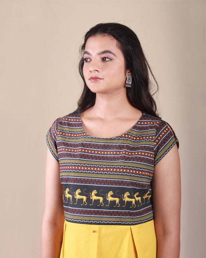 Closeup front view of Amphora Pottery Dress in cotton fabric with printed yoke detail and cap sleeves