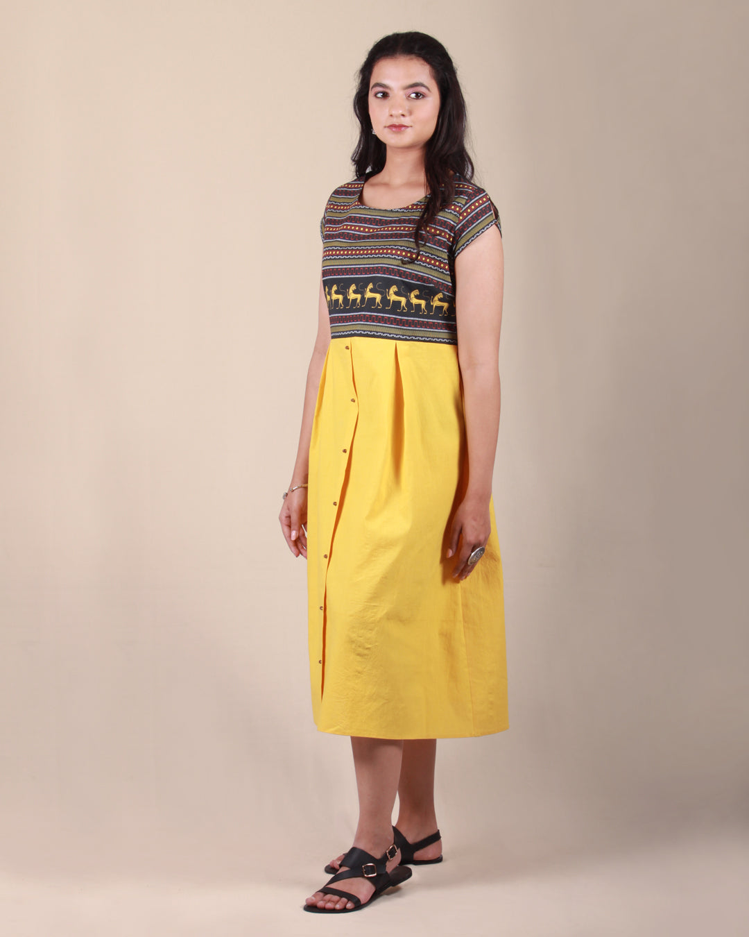 Full front view of Amphora Pottery Dress in cotton fabric with printed yoke detail and cap sleeves