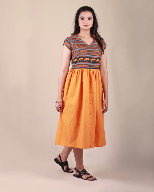 Full front view of orange Amphora Pottery Dress in cotton fabric with printed yoke detail and cap sleeves