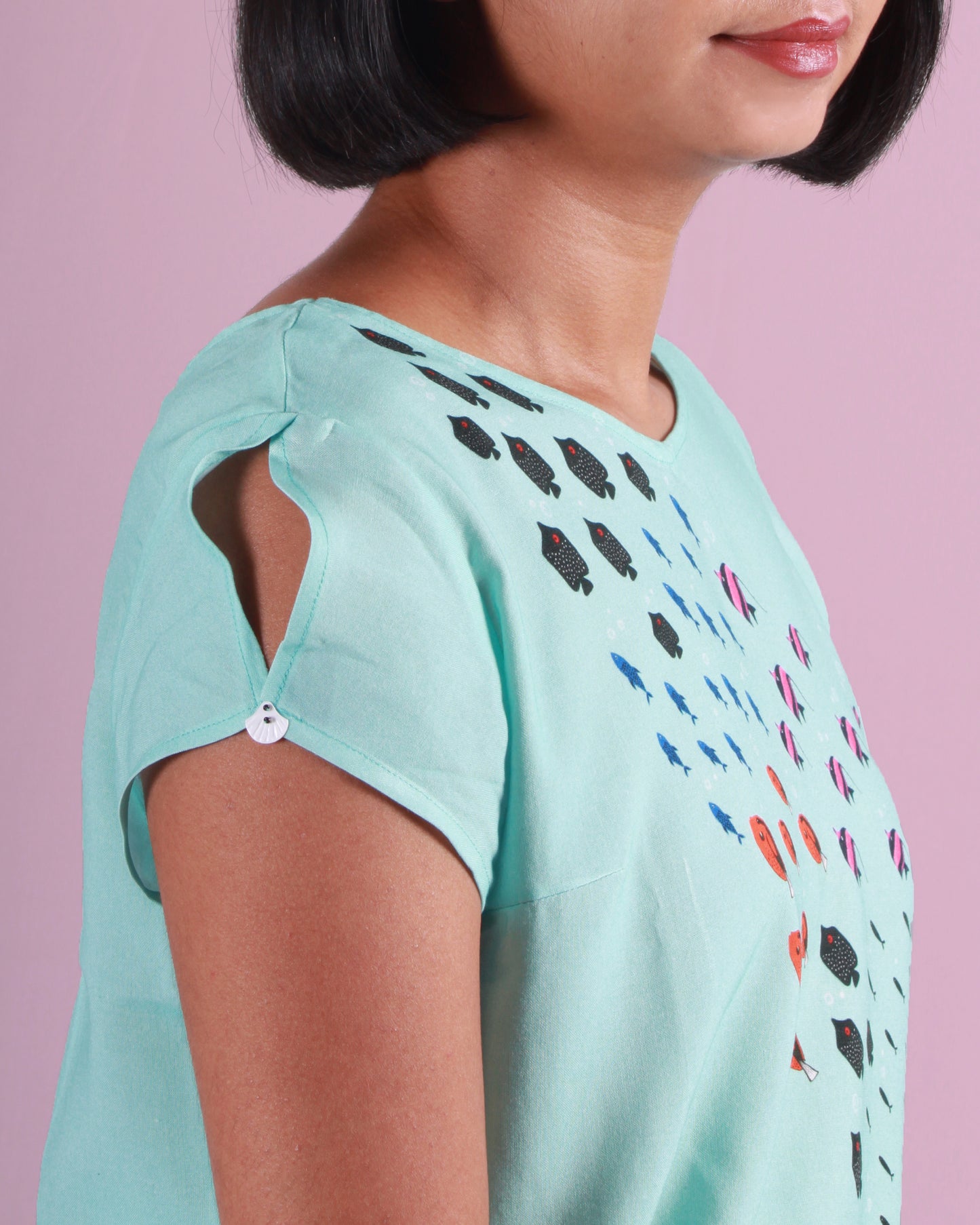 Sleeve detail close up Blue Fish Current Crop Top in cotton blend with drawstring detail at the waist and cap sleeves