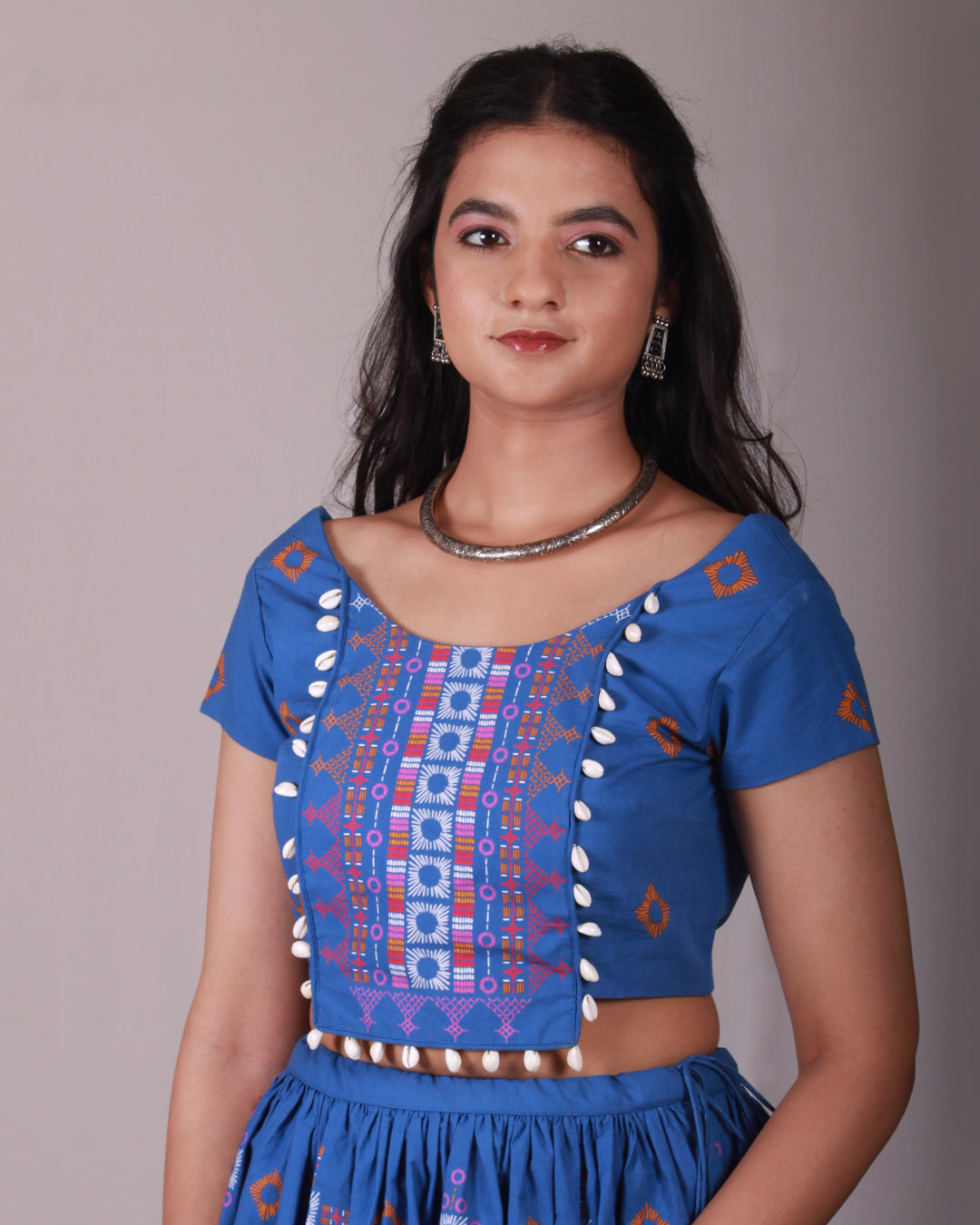 Front closeup of croptop of Blue Lambada Co-ord Set in cotton with chic cap sleeves, playful tassel and shell details