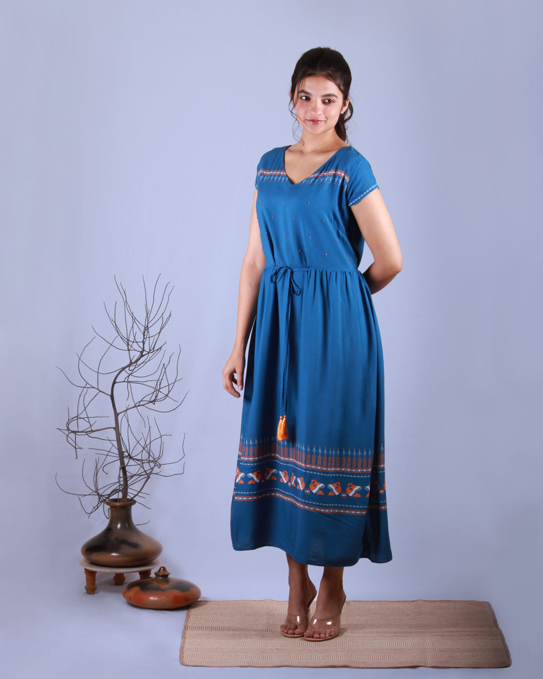 Full half side front view of Blue Pottery Maxi Dress in cotton blend with drawstring and cap sleeves detail