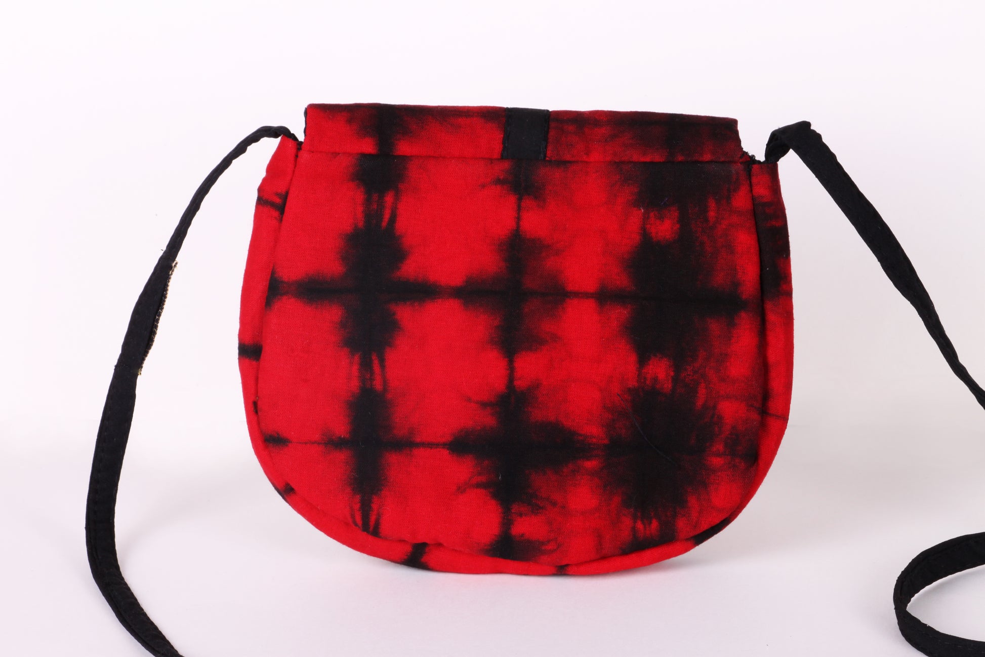 Back view of Red Check Sling Bag in cotton tie dye fabric with a magnetic snap closure and an interior pocket