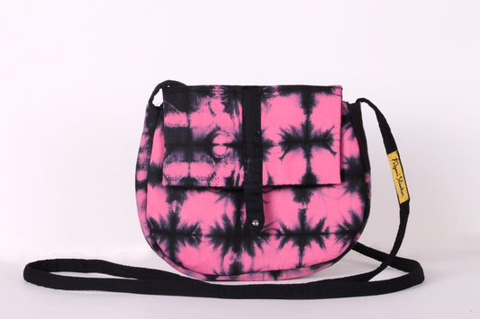 Front view of  Pink Check Sling Bag in cotton tie dye fabric with a magnetic snap closure and an interior pocket