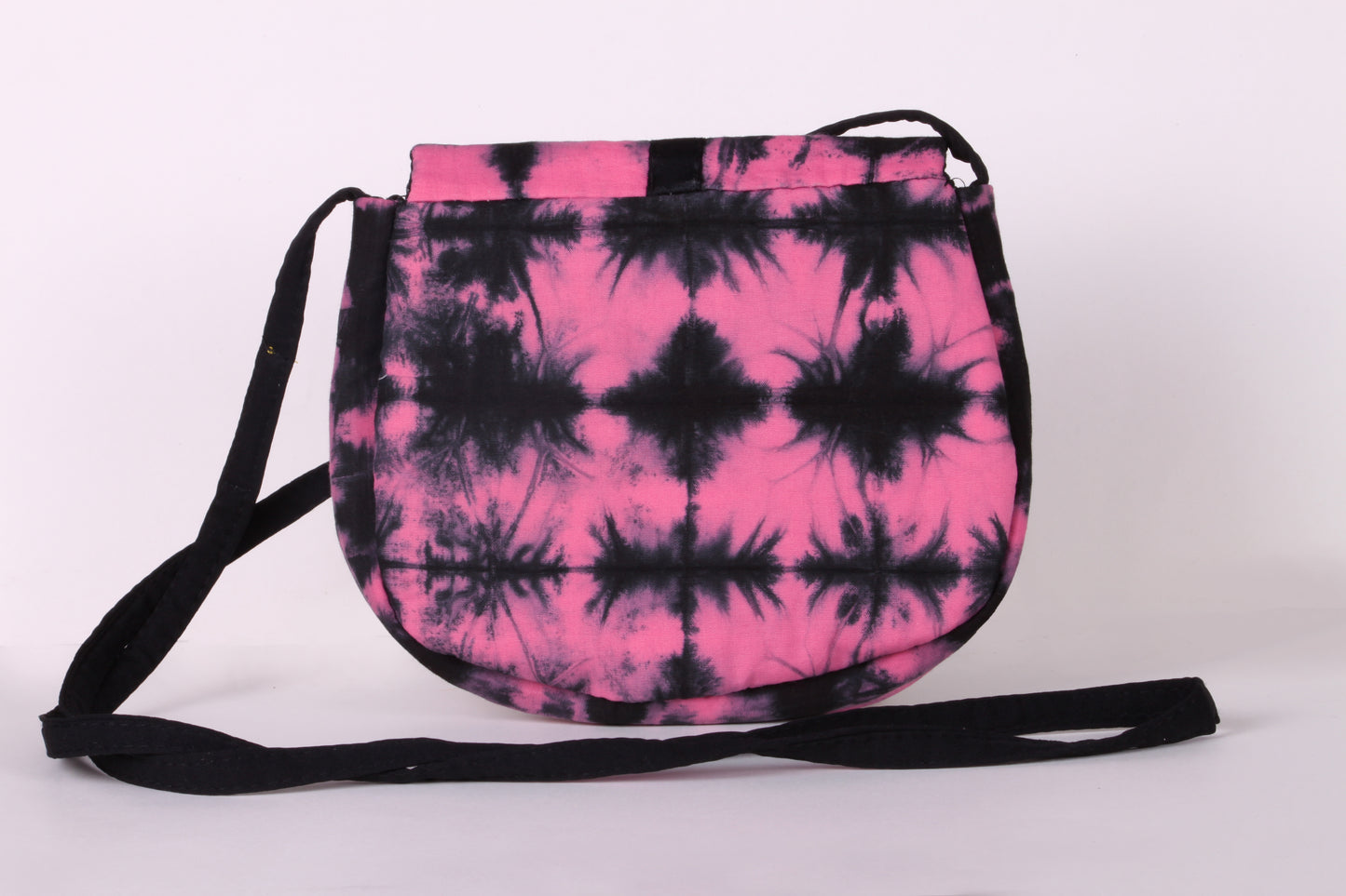 Back view of  Pink Check Sling Bag in cotton tie dye fabric with a magnetic snap closure and an interior pocket