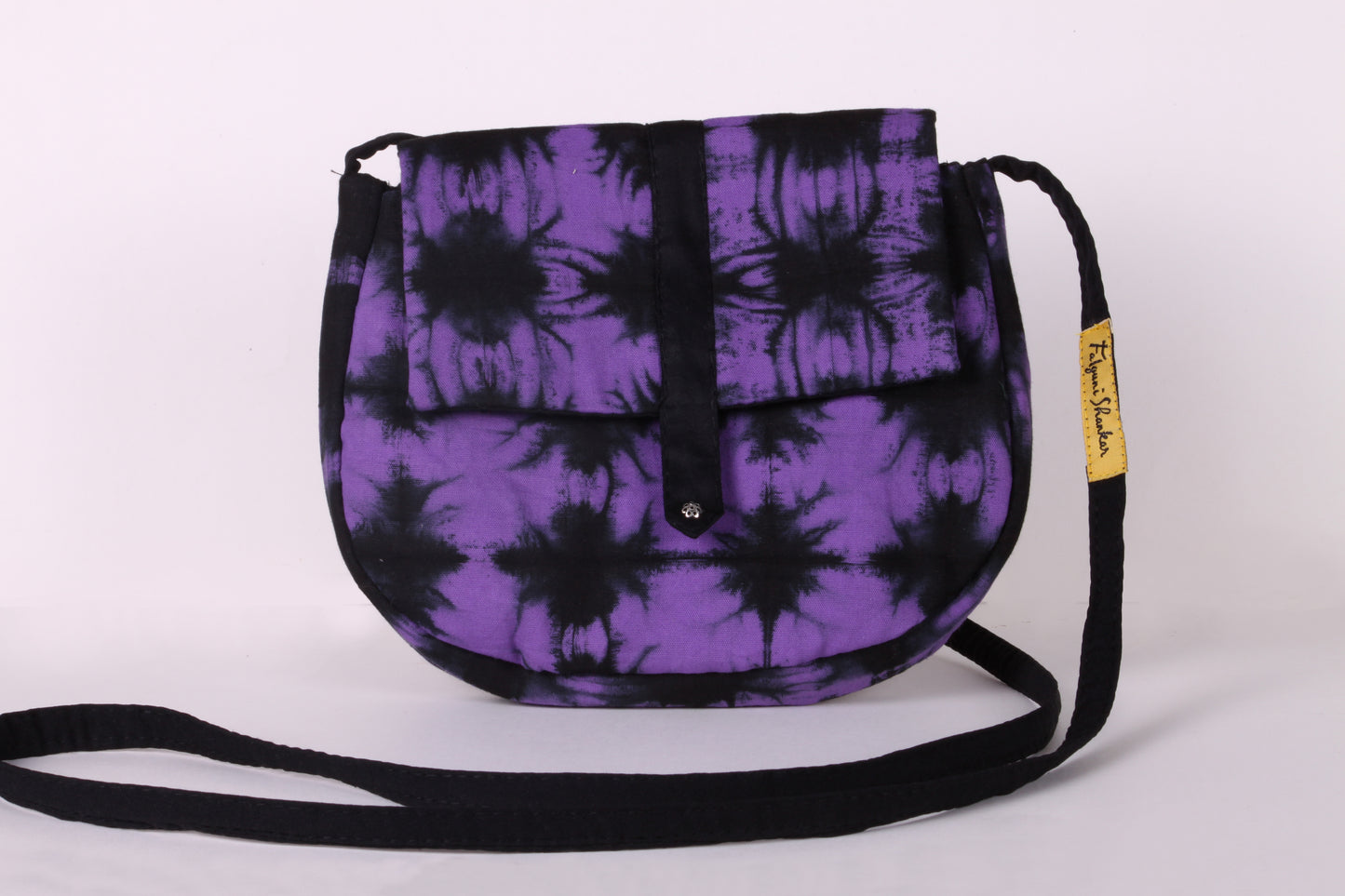 Front view of Violet Check Sling Bag in cotton tie dye fabric with a magnetic snap closure and an interior pocket