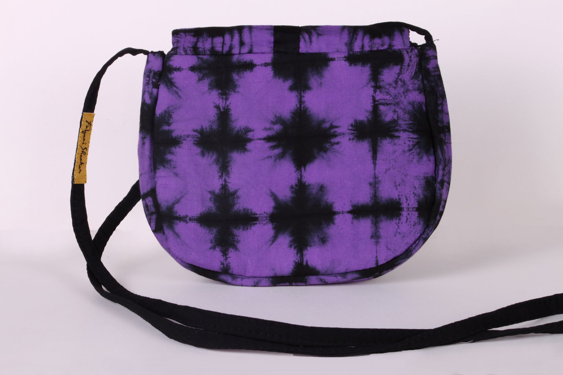 Back view of Violet Check Sling Bag in cotton tie dye fabric with a magnetic snap closure and an interior pocket