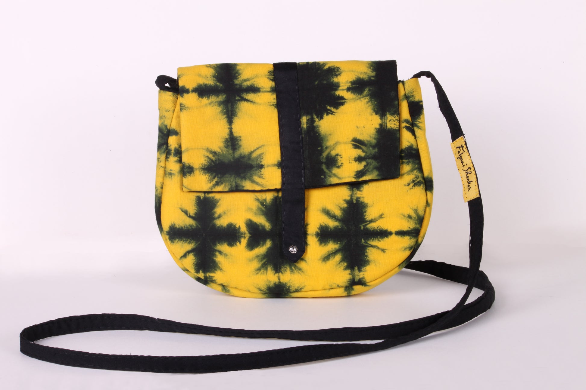 Front view of Yellow Check Sling Bag in cotton tie dye fabric with a magnetic snap closure and an interior pocket