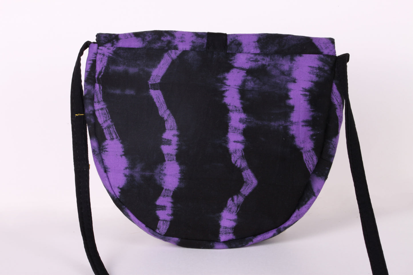 Back view of Violet Taco Sling Bag in cotton tie dye fabric with a magnetic snap closure and an interior pocket