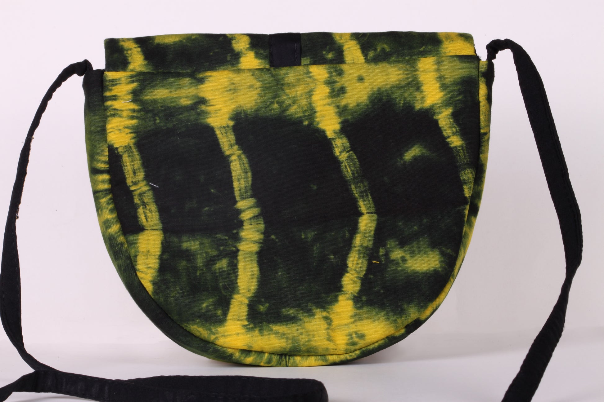 Back view of Yellow Taco Sling Bag in cotton tie dye fabric with a magnetic snap closure and an interior pocket