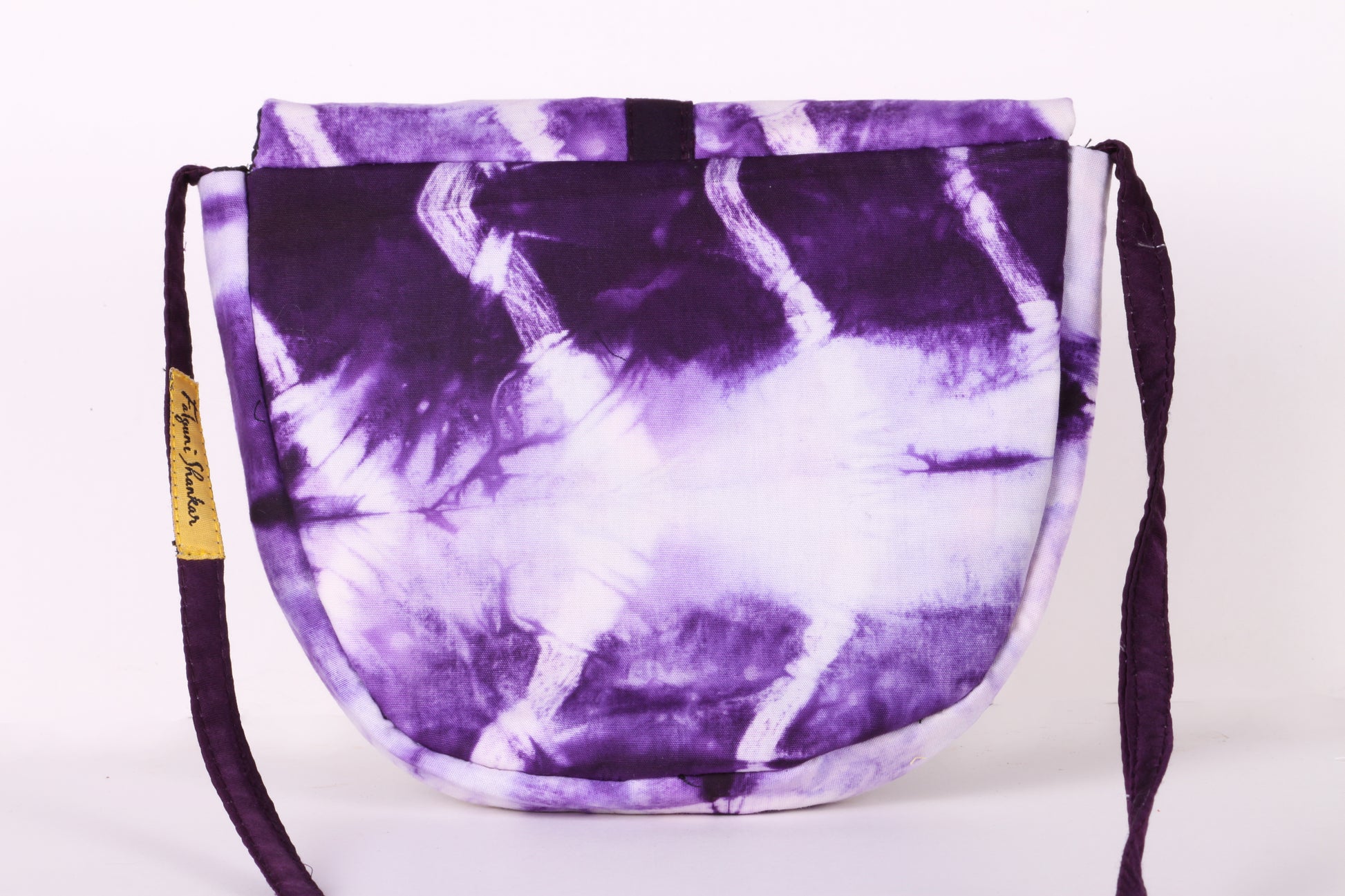 Back view of White Taco Sling Bag in cotton tie dye fabric with a magnetic snap closure and an interior pocket