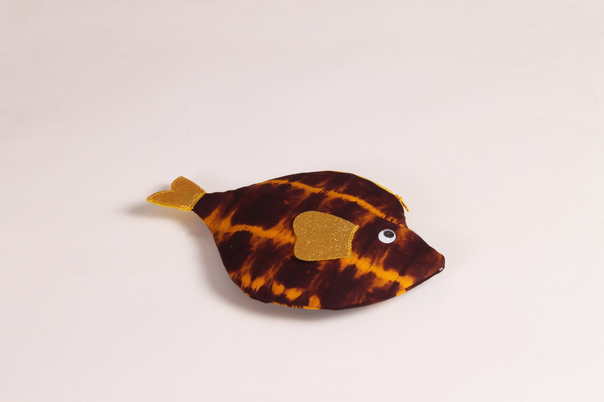 Flat view of Brown Pomfret Fish Pouch made from cotton fabric with a zip closure