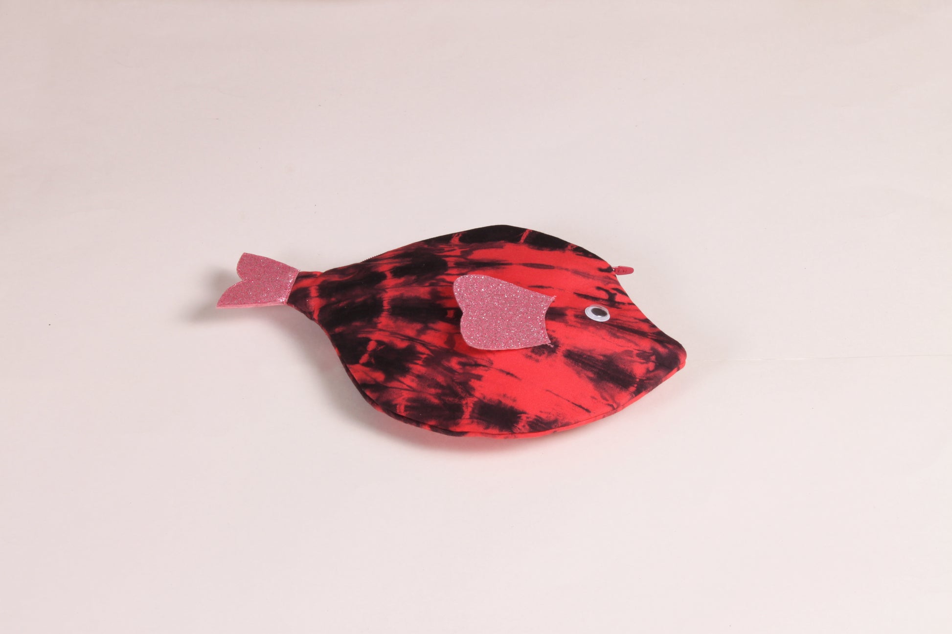 Flat view of Pink Pomfret Fish Pouch made from cotton fabric with a zip closure