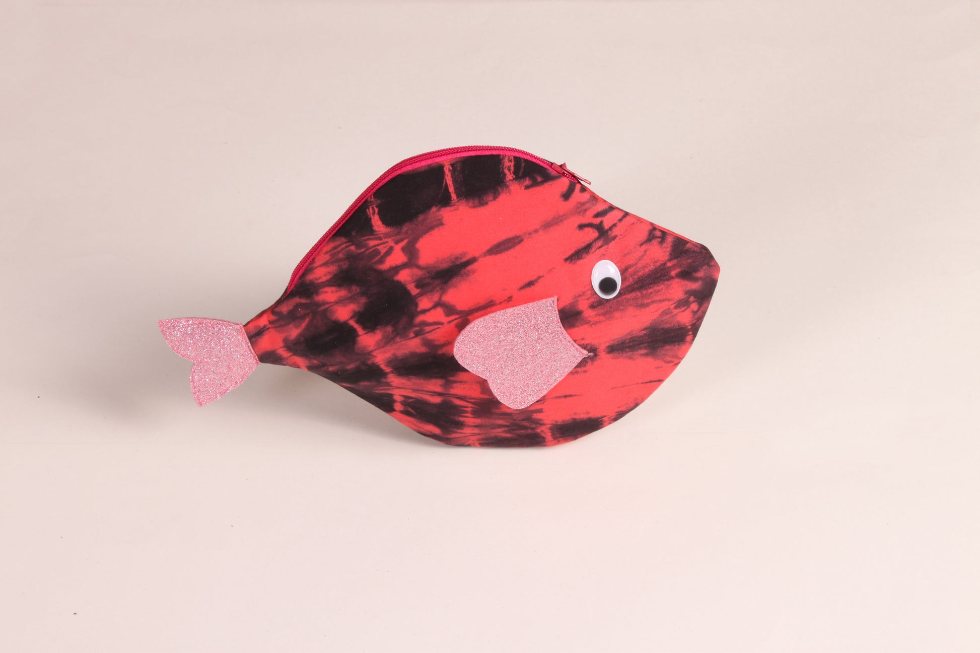 Side view of Pink Pomfret Fish Pouch made from cotton fabric with a zip closure