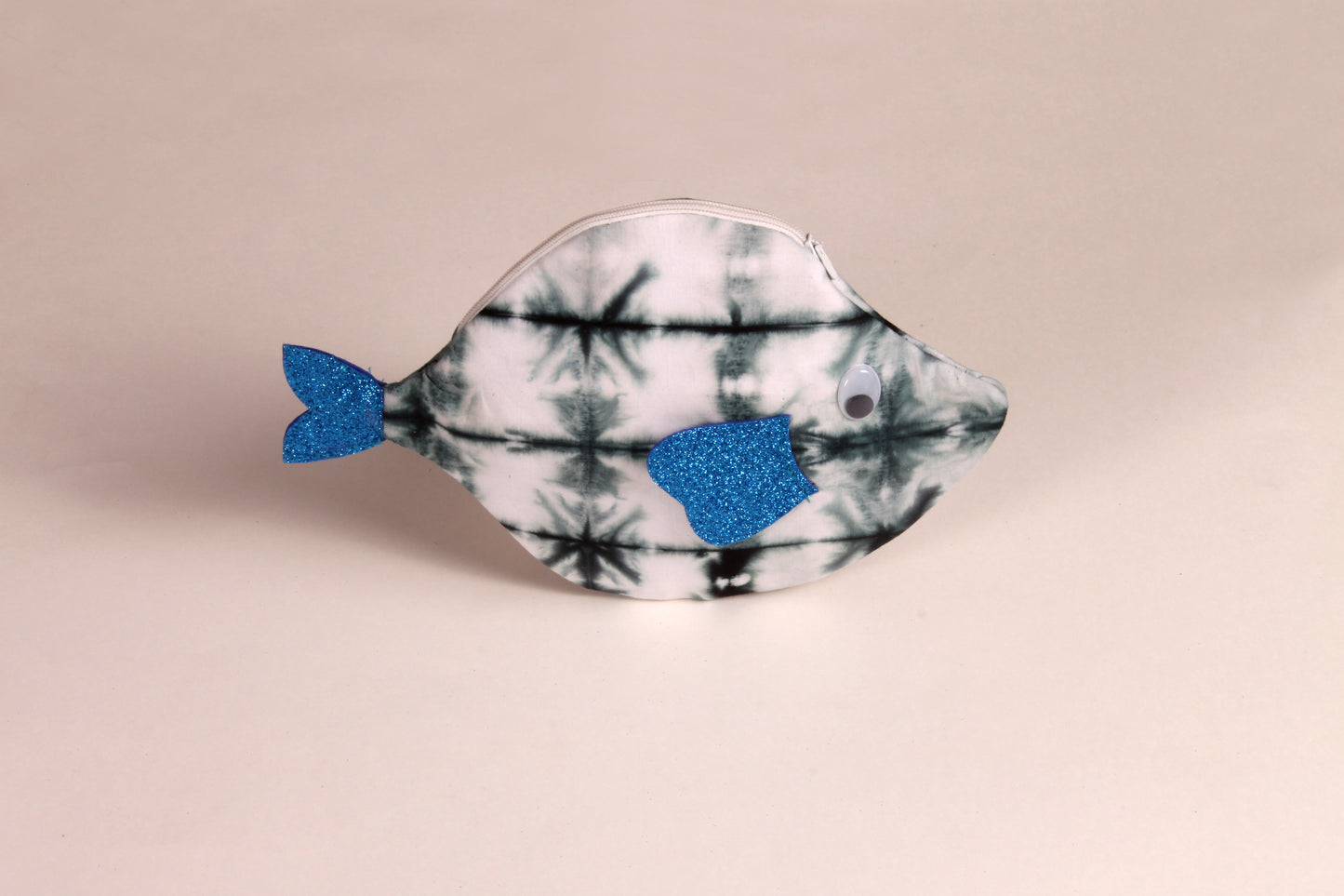 Side view of White Pomfret Fish Pouch made from cotton fabric with a zip closure