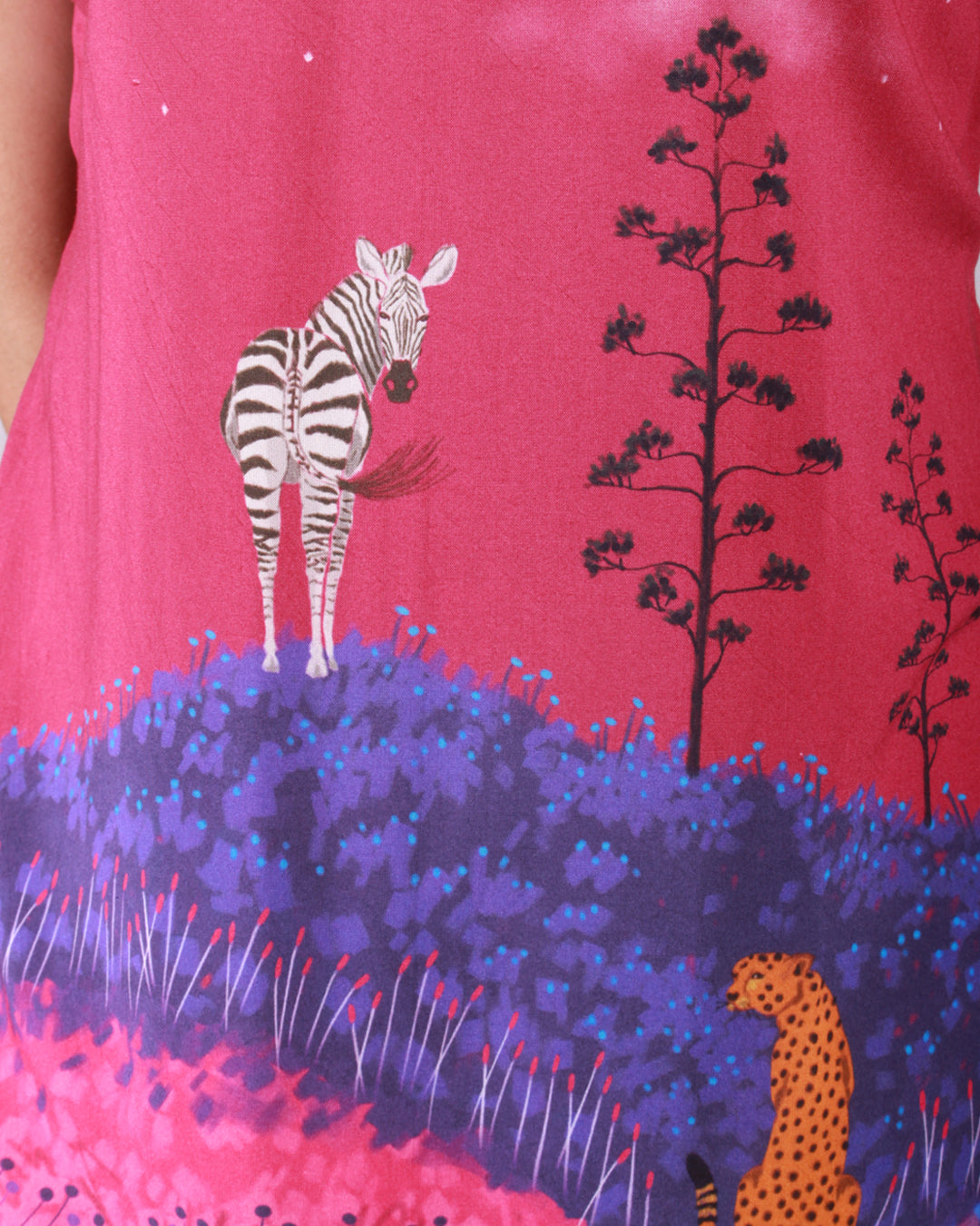 Closeup of print detail of pink Jungle Safari Tunic in cotton blend with an A-line silhouette and cap sleeves