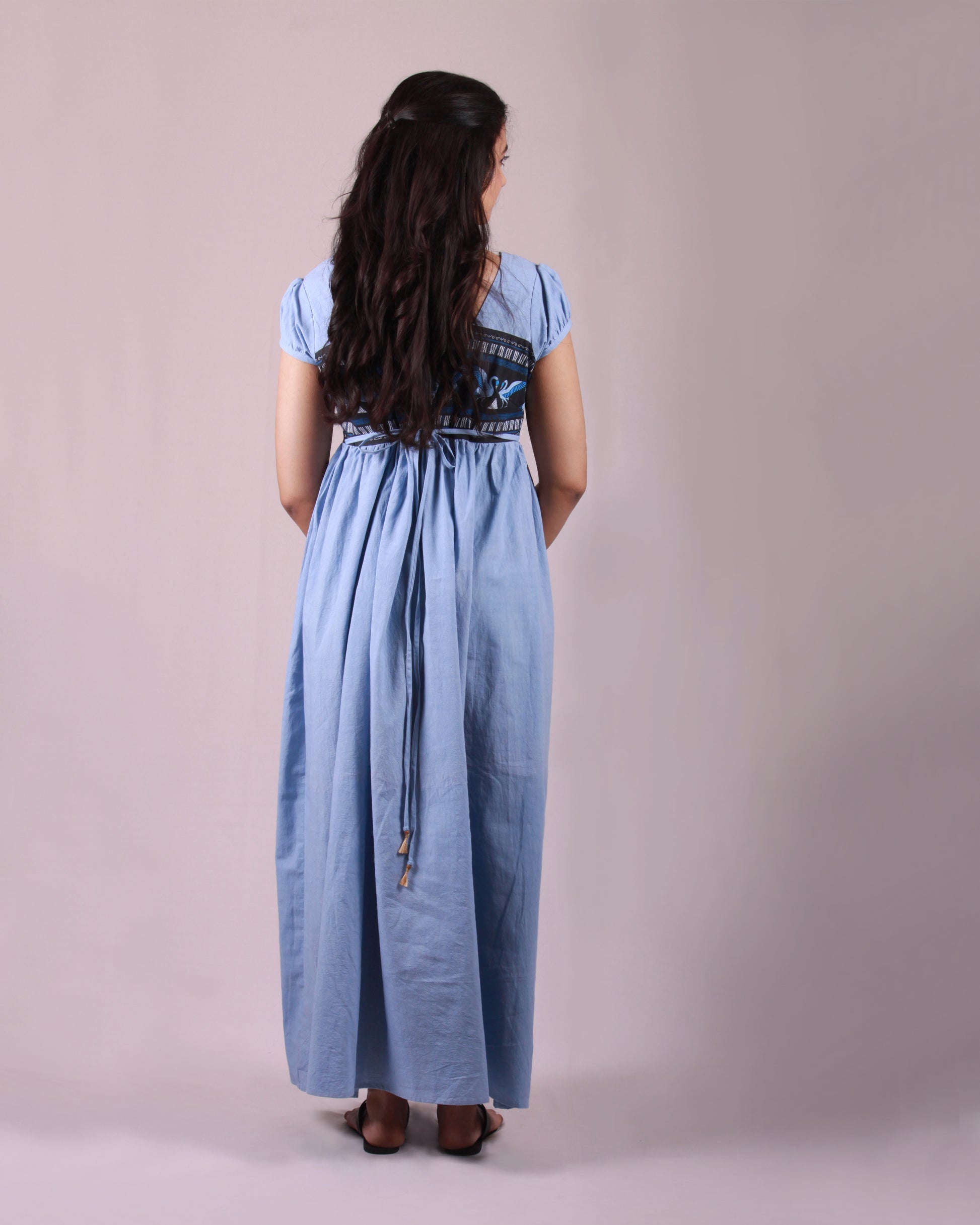 Back view of Powder Blue Pottery  Maxi Dress in cotton with drawstring details and puff sleeves