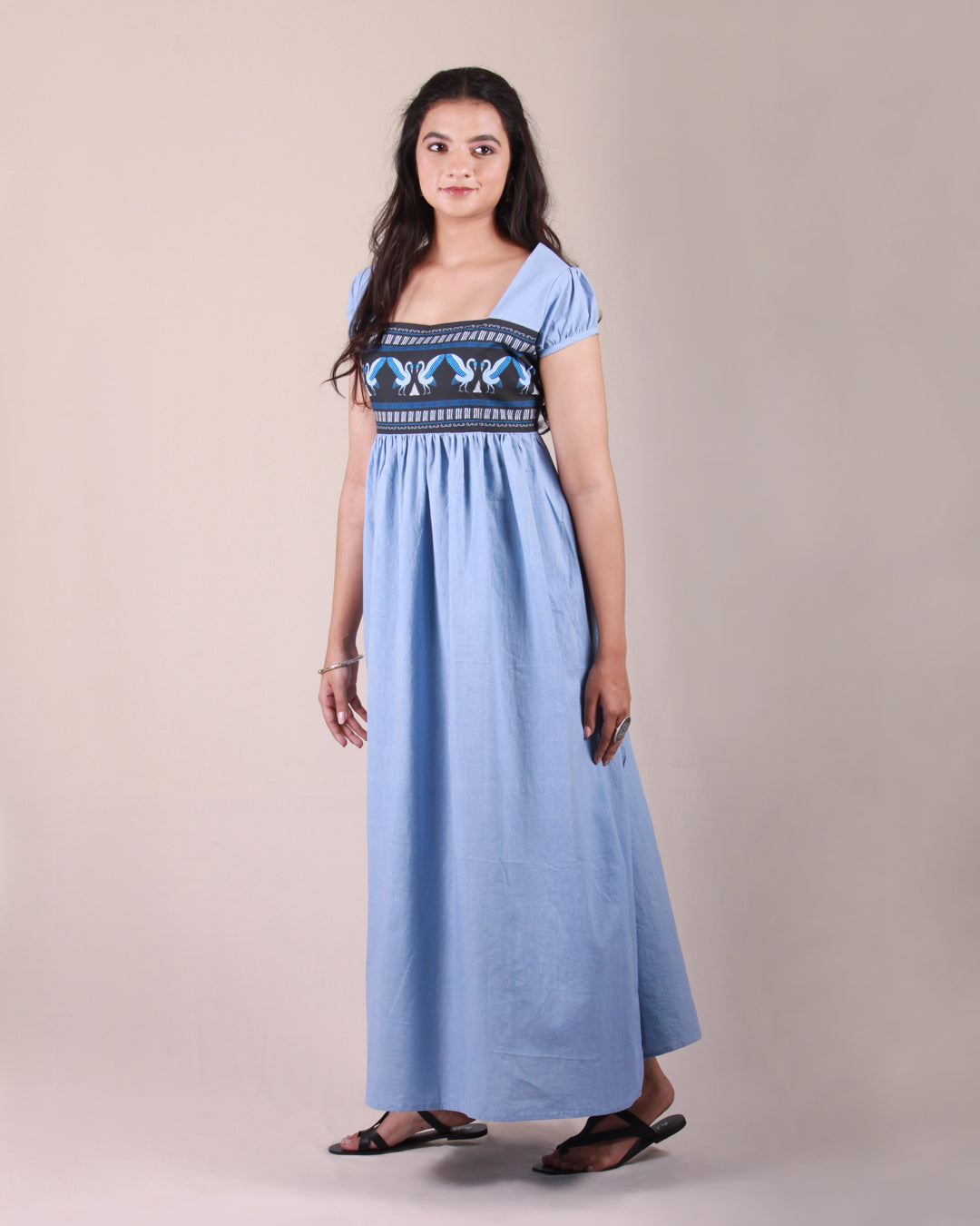 Full front view of Powder Blue Pottery  Maxi Dress in cotton with drawstring details and puff sleeves