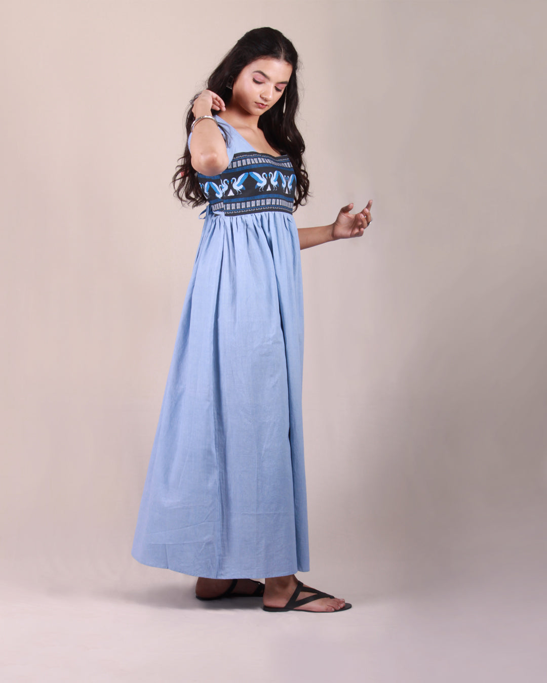 Full side front view of Powder Blue Pottery  Maxi Dress in cotton with drawstring details and puff sleeves