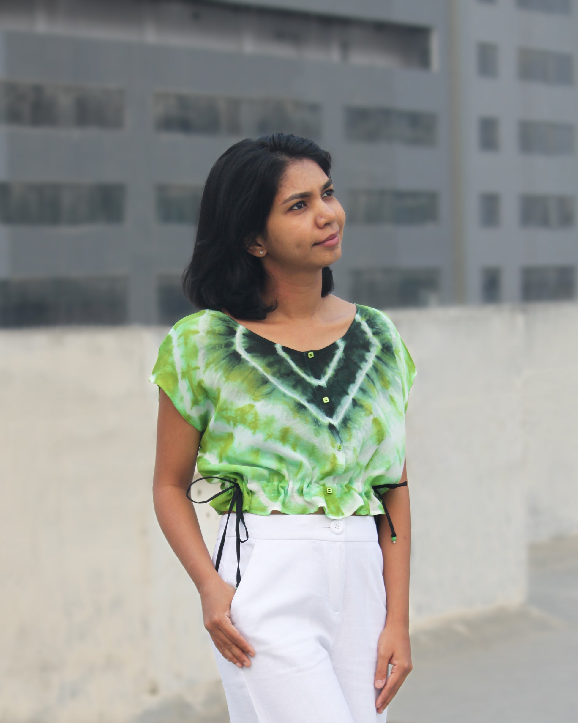 Front view of Tie Dye Green Black Crop Top in cotton blend with drawstring detail at waist