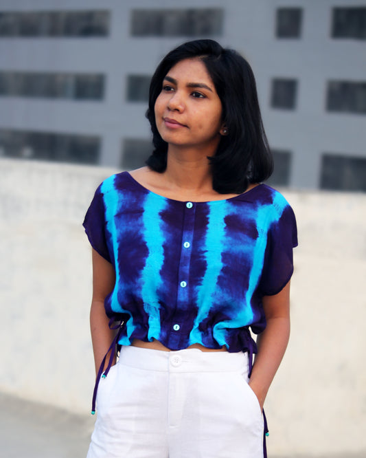 Front view of Tie Dye Blue Violet Crop Top in cotton blend with drawstring detail at waist