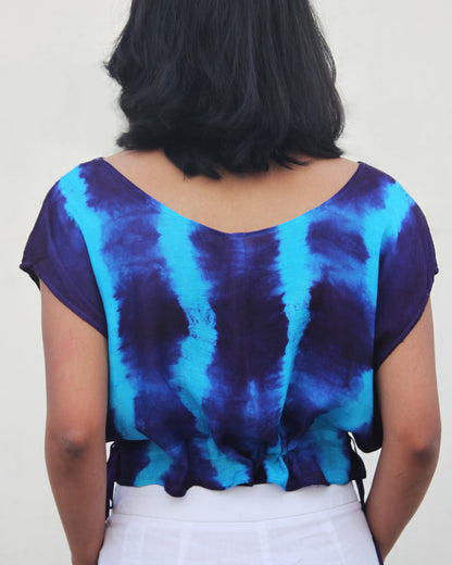 Back view of Tie Dye Blue Violet Crop Top in cotton blend with drawstring detail at waist