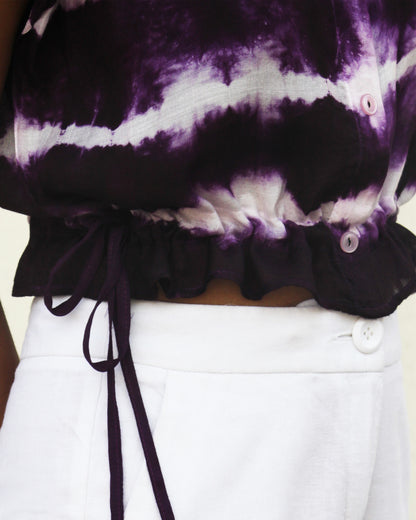 Side view of Tie Dye Violet White Crop Top in cotton blend with drawstring detail at waist