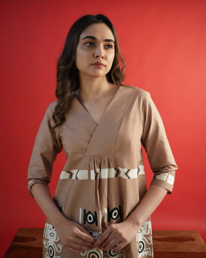 Close-up of tribal motif details on the beige cotton empire-line kurta from the Chaki Co-ord Set