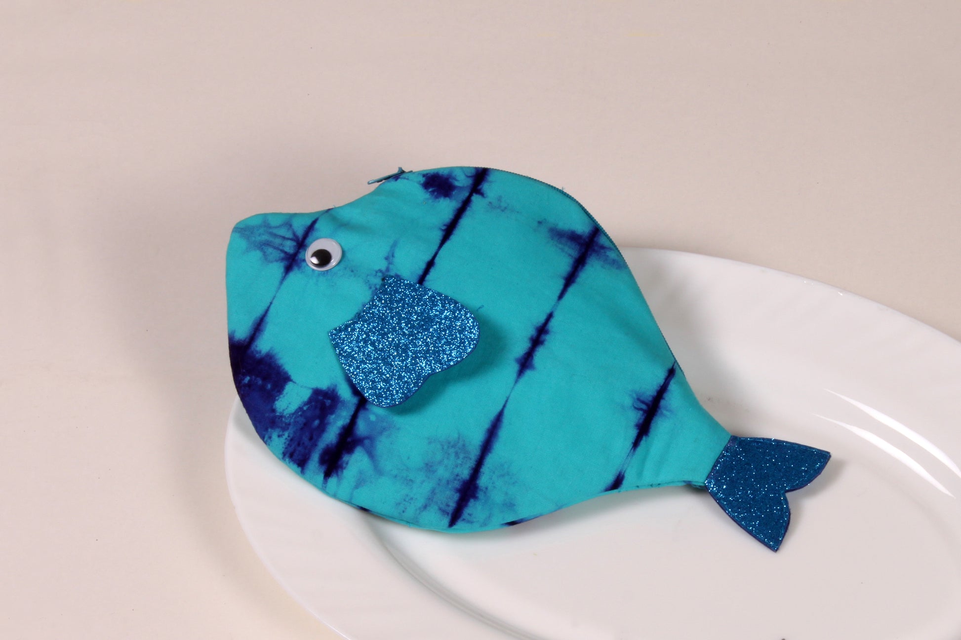 Side view of Blue Pomfret Fish Pouch made from cotton fabric with a zip closure