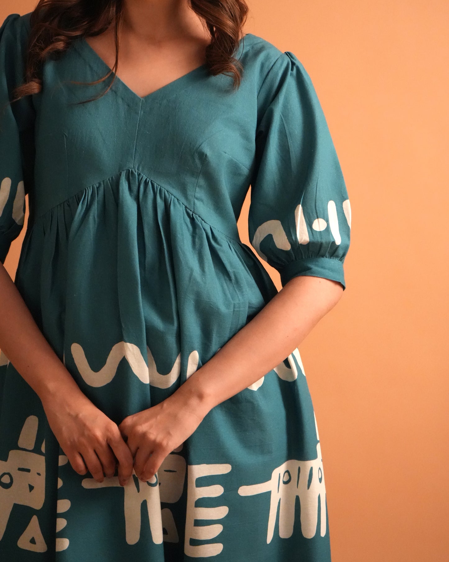 Detailed shot of neckline and sleeve design on the teal blue Polu Cotton Co-ord Set