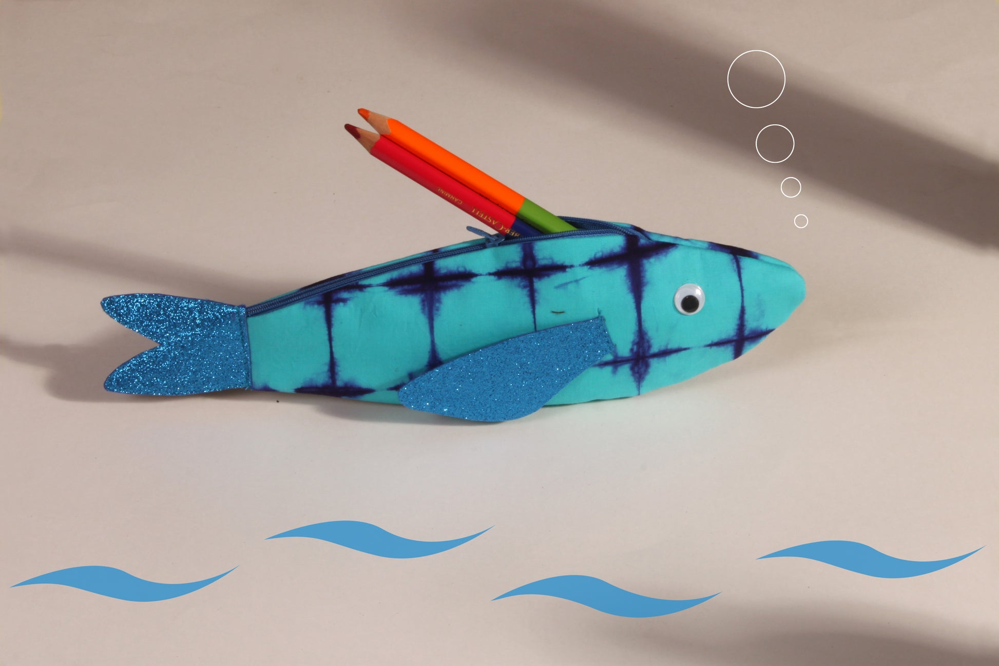 Side view of Blue Rohu Fish Pouch made from cotton fabric showing stationery organised 