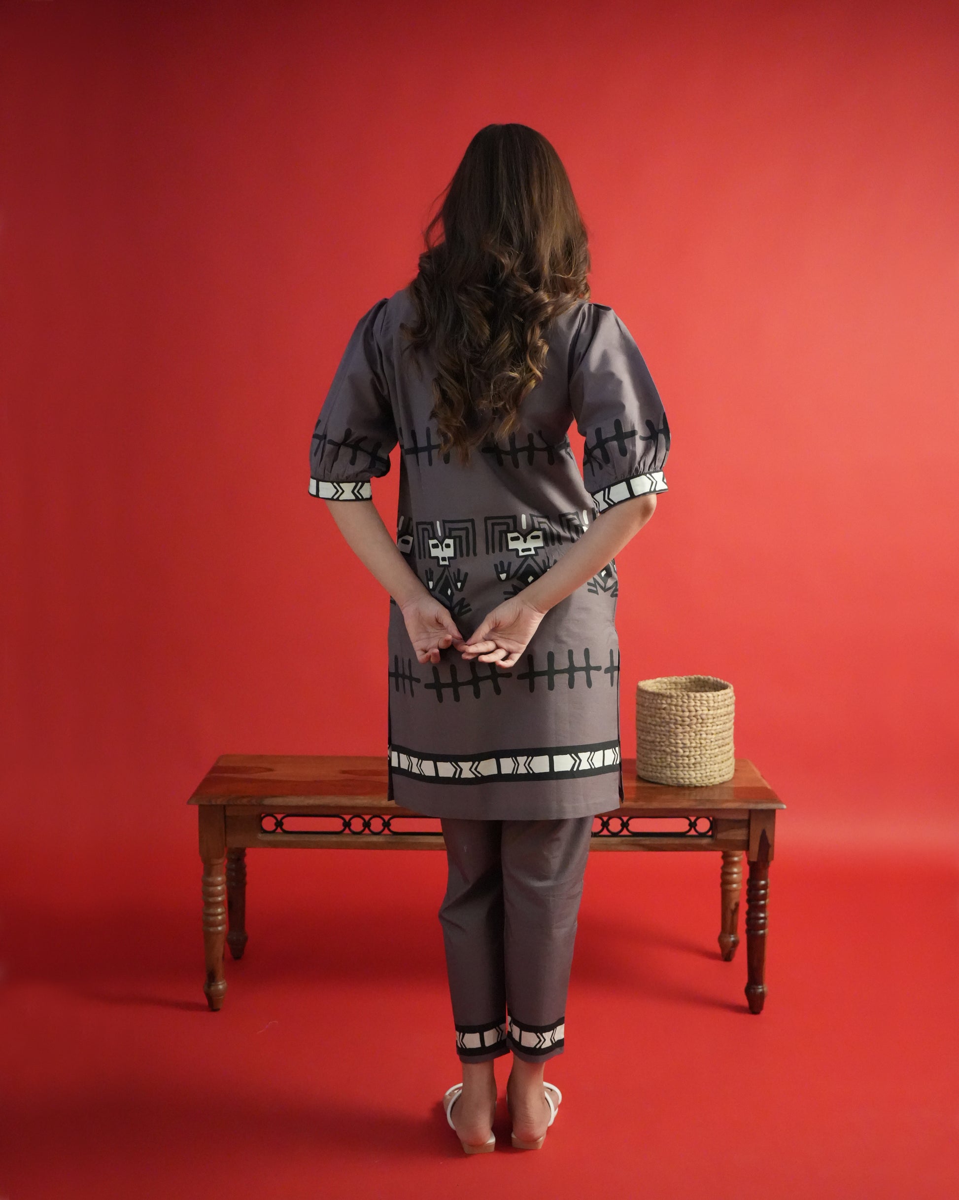 Back view of rich brown Tua Cotton Kurta Co-ord Set showing puffed sleeves and narrow trousers