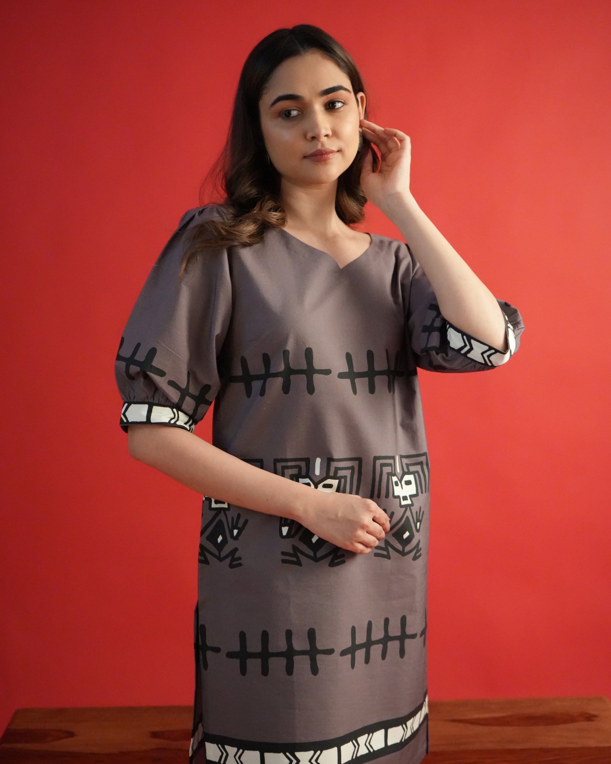 Detailed shot of neckline and sleeves on the rich brown Tua Cotton Kurta Co-ord Set