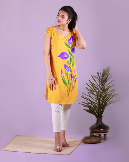 Full front view of yellow Calla Lily Tunic in cotton blend with slight puff cap sleeves and drawstring detail