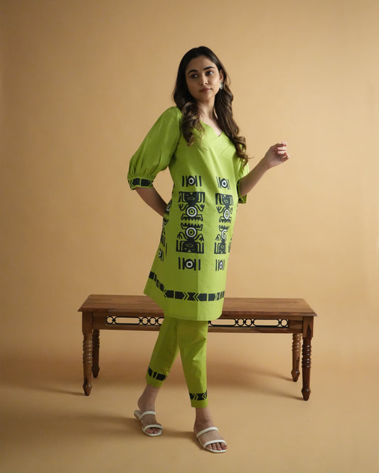 Side view of Amali Cotton Co-ord Set in leaf green with puff sleeves, V-neck, and tribal prints