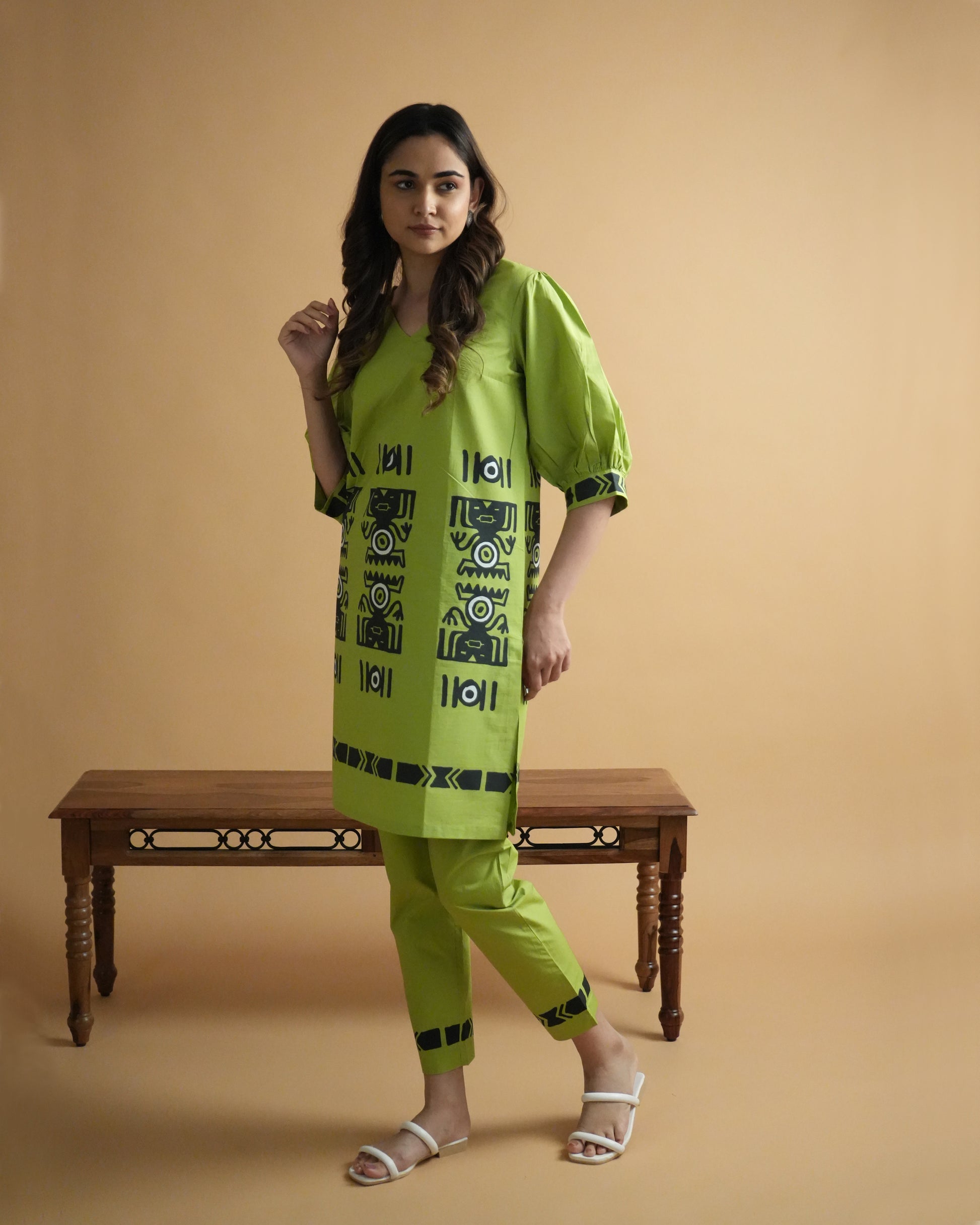 Front view of Amali Cotton Co-ord Set in leaf green with V-neck kurta, puff sleeves, tribal motifs, and straight-fit pants