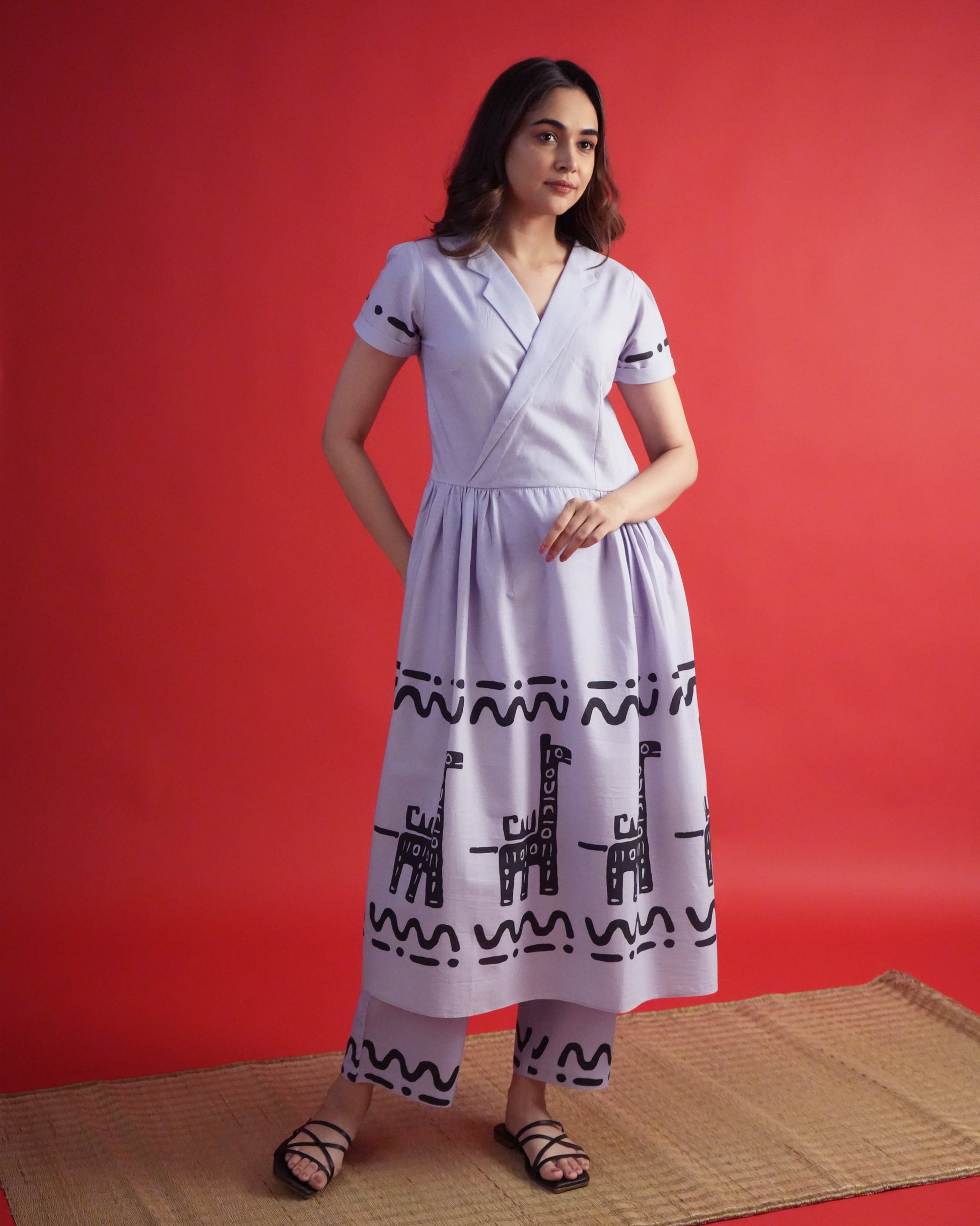 Model wearing Usu Cotton Co-ord Set with lavender lapel-collar kurta, cuffed sleeves, tribal prints, and wide-leg pants