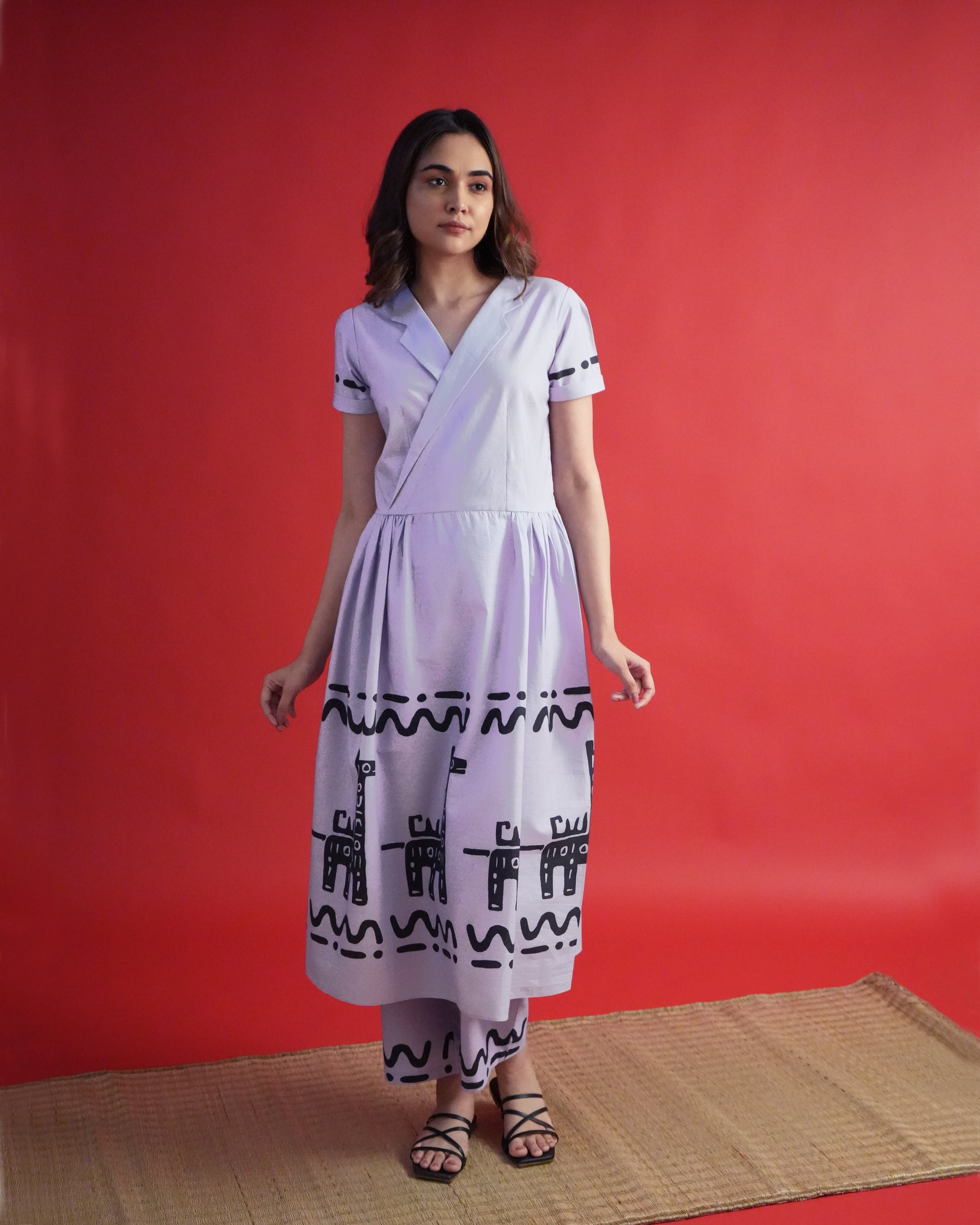 Side view of Usu Cotton Co-ord Set in lavender with tribal prints, lapel-collar kurta, and wide-leg pants.