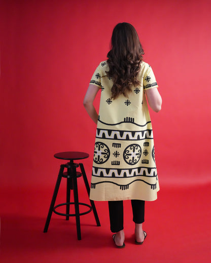 Back view of the Kiiro Cotton Co-ord Set showing the pastel yellow wrap kurta design with black narrow-leg trousers